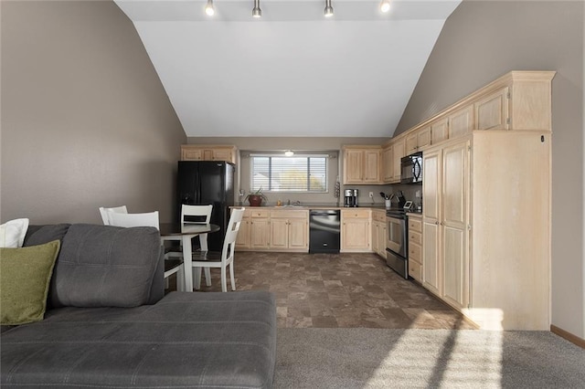 kitchen featuring track lighting, light brown cabinets, open floor plan, black appliances, and a sink