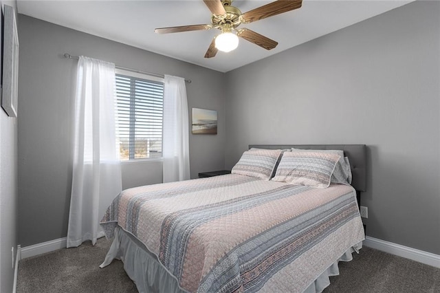 bedroom with a ceiling fan, baseboards, and carpet floors