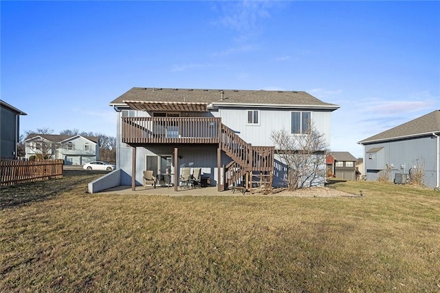 rear view of property with a lawn, a deck, a pergola, stairway, and a patio area