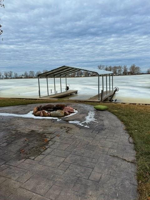 view of patio featuring a dock