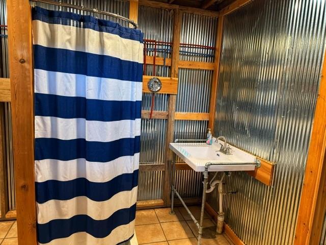 239 Mallard Ln, Big Lake, MO 64437 - full bath with a shower with shower curtain and tile patterned floors