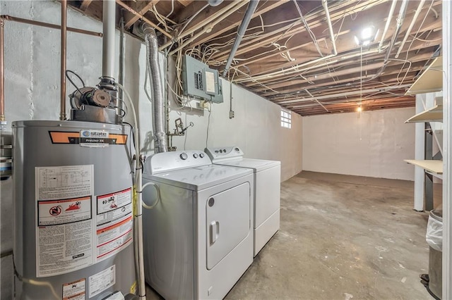 washroom featuring laundry area, separate washer and dryer, gas water heater, and electric panel