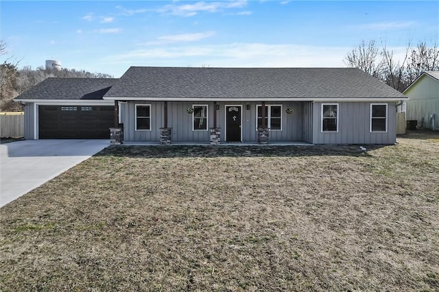 ranch-style house with driveway, a garage, a porch, board and batten siding, and a front yard