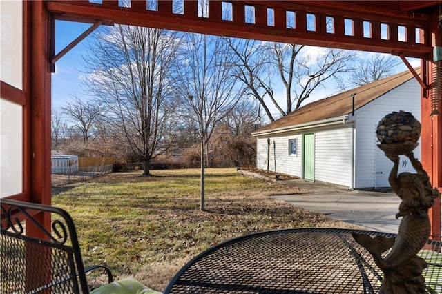 view of yard featuring an outdoor structure and fence