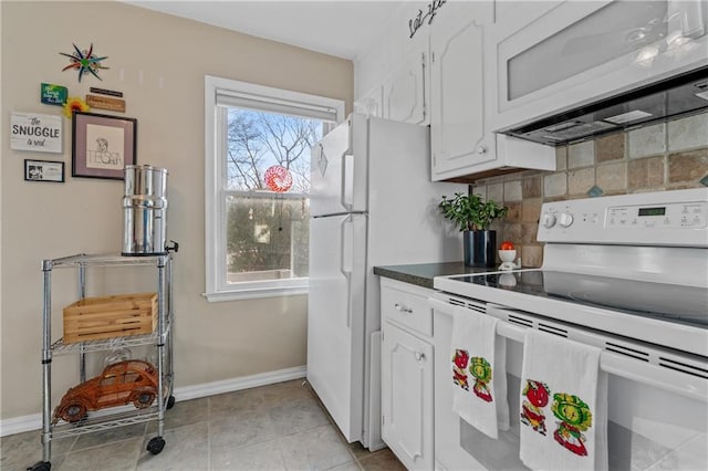 kitchen featuring white cabinetry, white appliances, baseboards, and tasteful backsplash