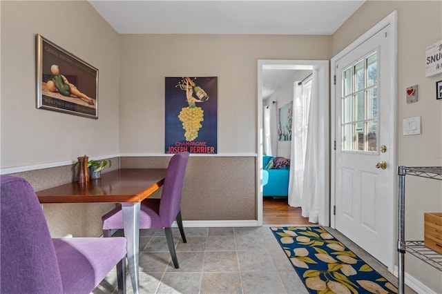 tiled dining space with baseboards