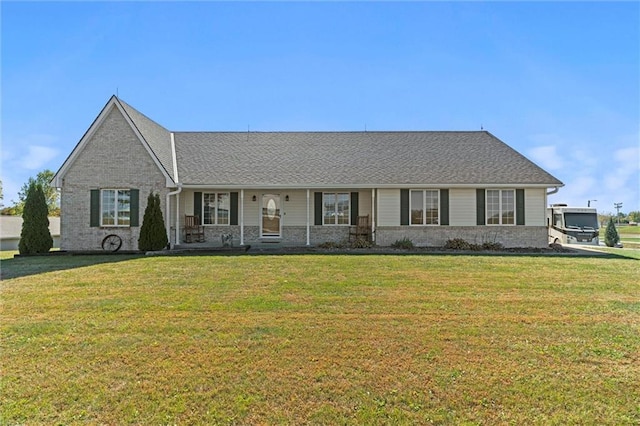 single story home with brick siding and a front yard