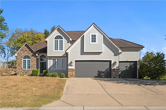 view of front facade with stucco siding, a garage, stone siding, driveway, and a front lawn