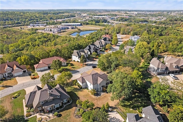 birds eye view of property with a water view and a residential view