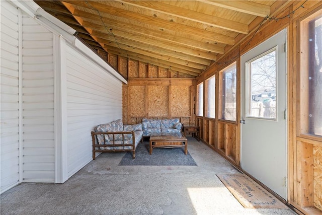 unfurnished sunroom with lofted ceiling