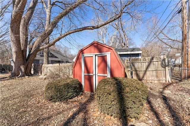 view of shed with fence