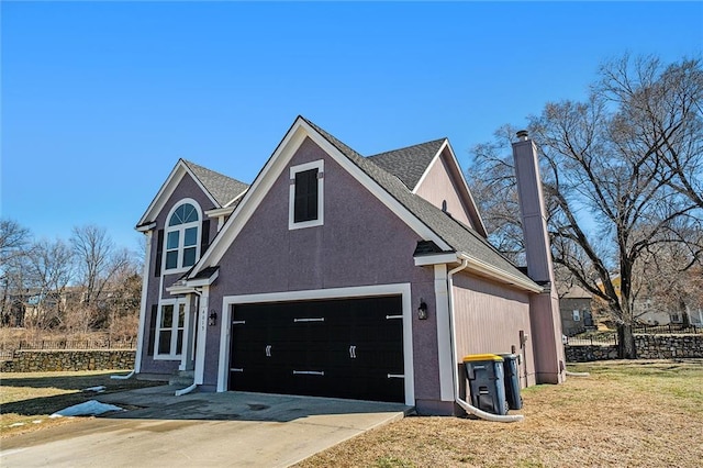 view of side of property featuring driveway, a garage, a chimney, and a lawn