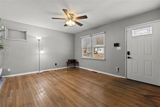 foyer entrance featuring ceiling fan, hardwood / wood-style floors, and baseboards