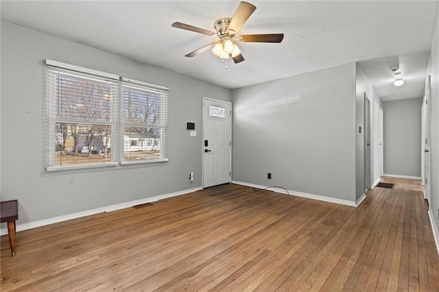 entrance foyer featuring hardwood / wood-style flooring, baseboards, visible vents, and ceiling fan