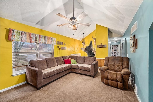 carpeted living room with lofted ceiling, visible vents, ceiling fan, a textured ceiling, and baseboards