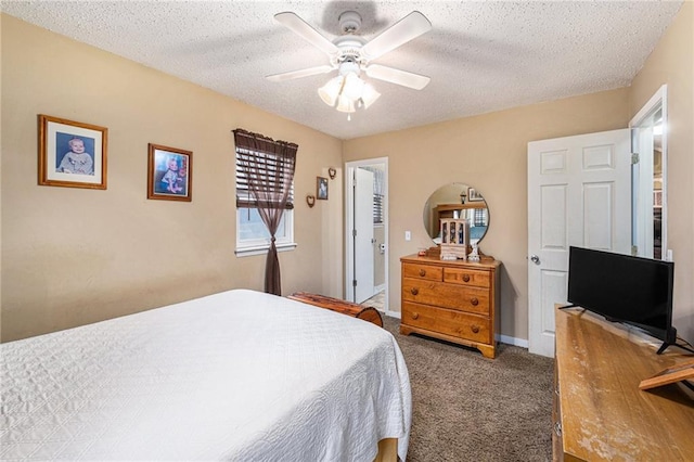 bedroom with carpet floors, a textured ceiling, baseboards, and a ceiling fan