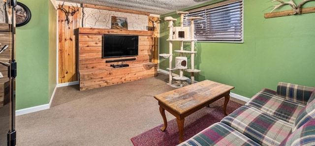 living room featuring a textured ceiling, carpet floors, and baseboards