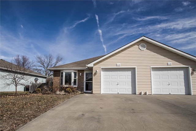 ranch-style home with driveway, a garage, and brick siding