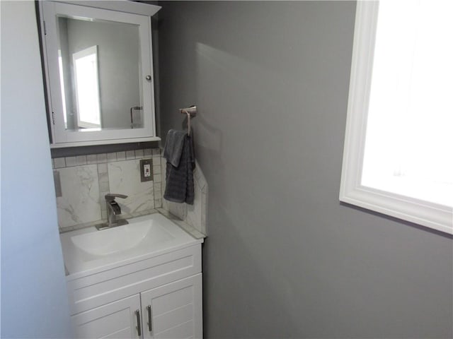 bathroom with backsplash and vanity