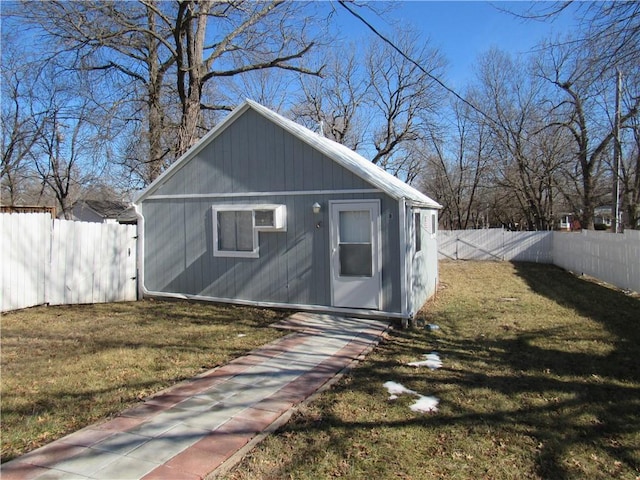 view of outbuilding featuring a fenced backyard