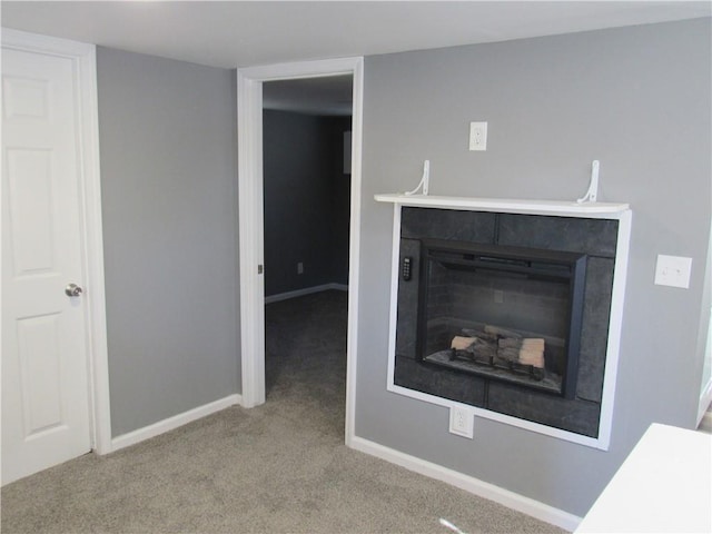 details featuring carpet flooring, a fireplace, and baseboards