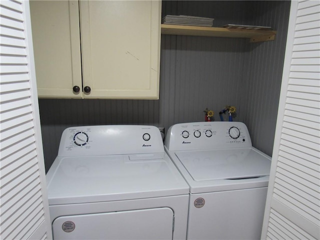 laundry area featuring cabinet space and washing machine and clothes dryer