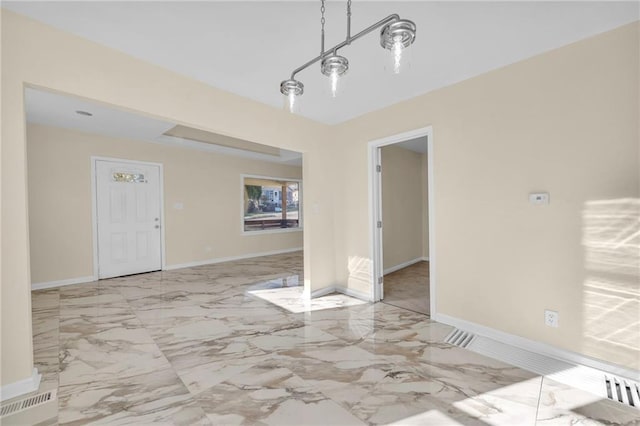 unfurnished dining area featuring marble finish floor, visible vents, and baseboards