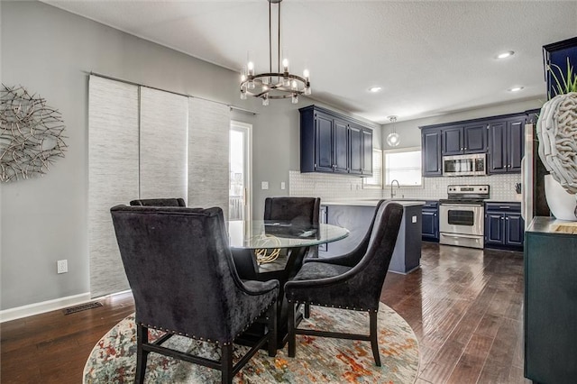 dining space with recessed lighting, visible vents, baseboards, and dark wood finished floors