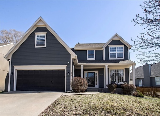 view of front of home with concrete driveway, covered porch, fence, and a garage