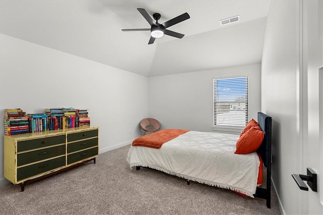 carpeted bedroom with visible vents, ceiling fan, baseboards, and vaulted ceiling