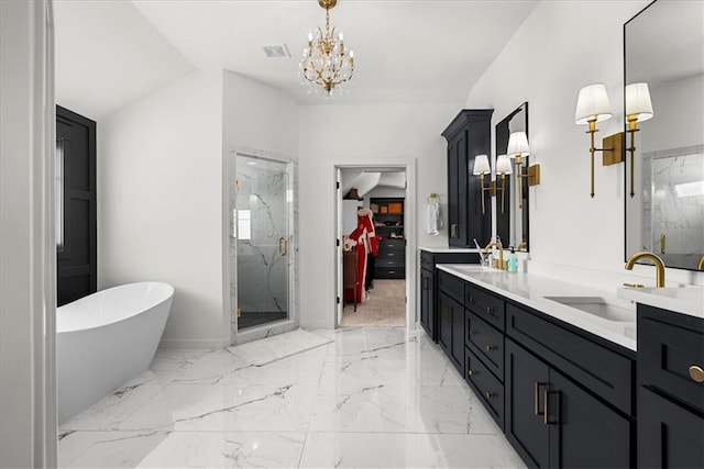 bathroom with a sink, a marble finish shower, a soaking tub, and marble finish floor