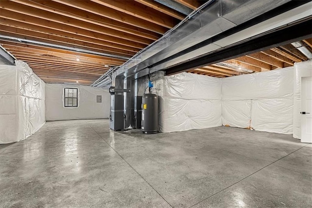 basement with water heater and heating unit