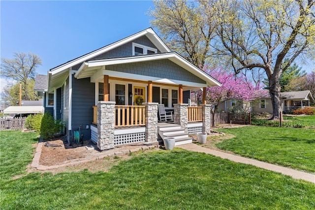 view of front of home featuring a porch and a front yard