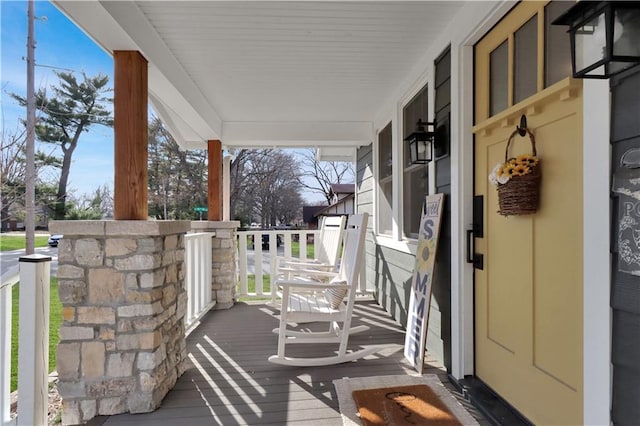 wooden deck featuring covered porch