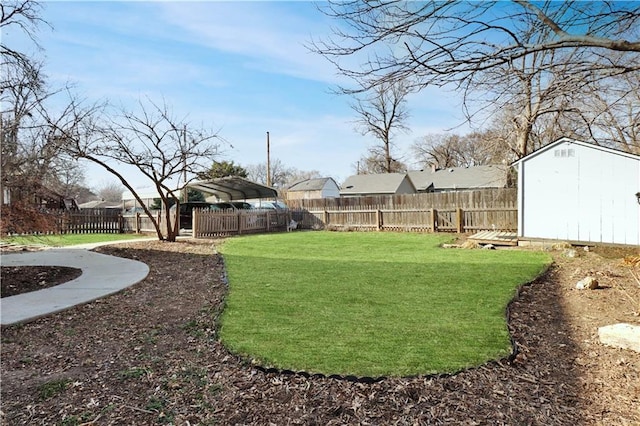 view of yard with a storage unit, an outdoor structure, and a fenced backyard