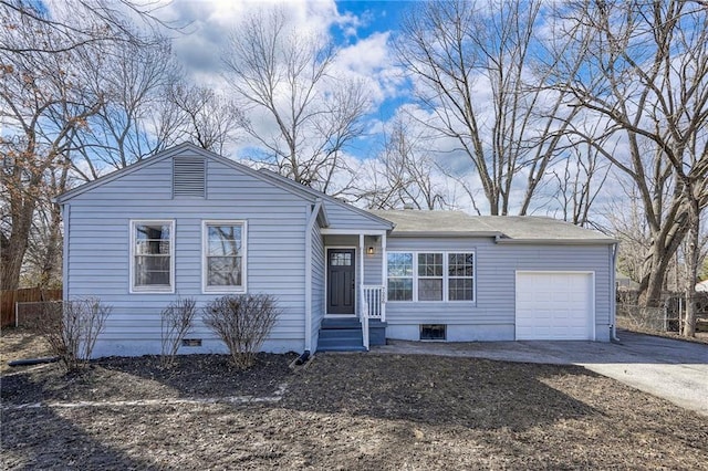 ranch-style home featuring crawl space, driveway, an attached garage, and fence