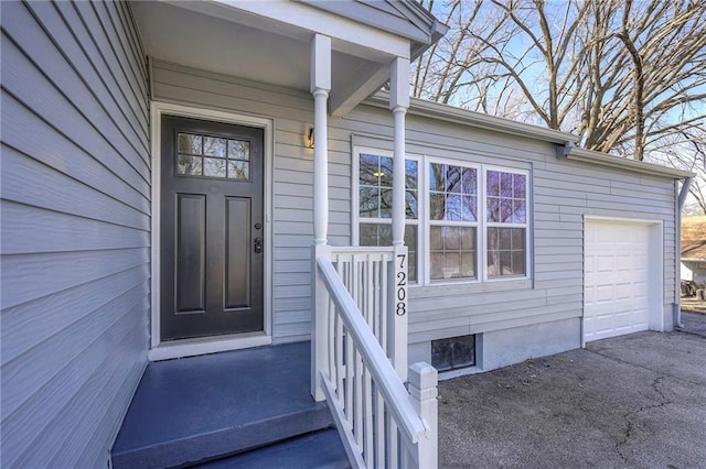 doorway to property featuring a garage