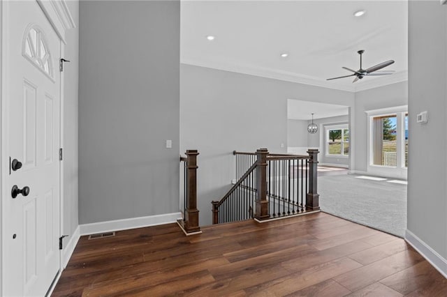 hallway with crown molding, recessed lighting, an upstairs landing, wood finished floors, and baseboards