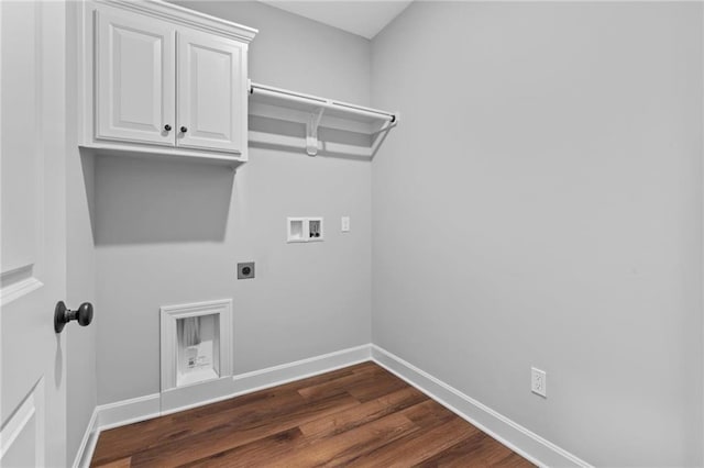 washroom with baseboards, hookup for a washing machine, dark wood finished floors, and hookup for an electric dryer