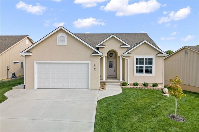 2407 Merlot Pl, Excelsior Springs, MO 64024 - traditional-style home featuring an attached garage, driveway, a front yard, and stucco siding
