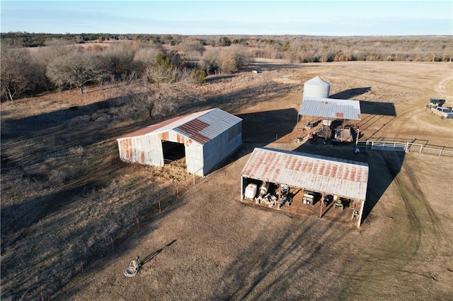 birds eye view of property with a rural view