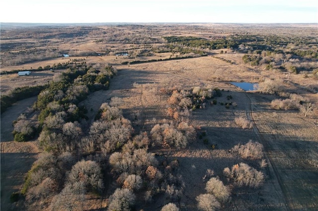 birds eye view of property featuring a rural view