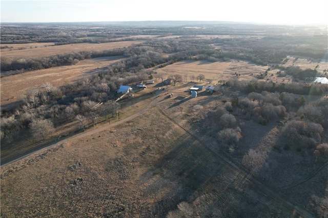 birds eye view of property featuring a rural view