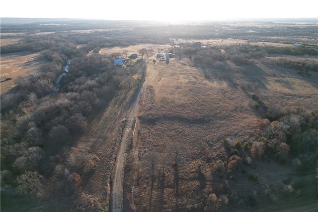 birds eye view of property with a rural view