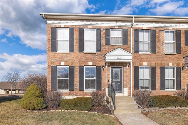 view of front of home featuring brick siding