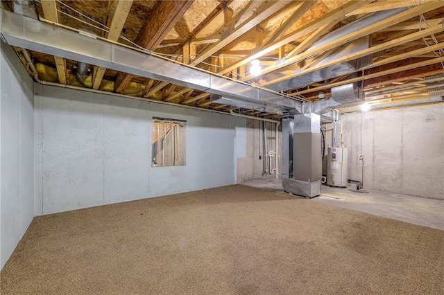 unfinished below grade area with carpet, electric water heater, and heating unit