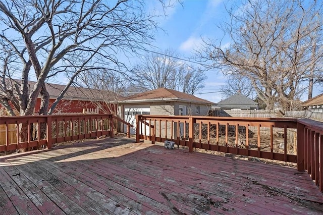 wooden terrace featuring fence