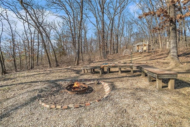 view of yard with a fire pit