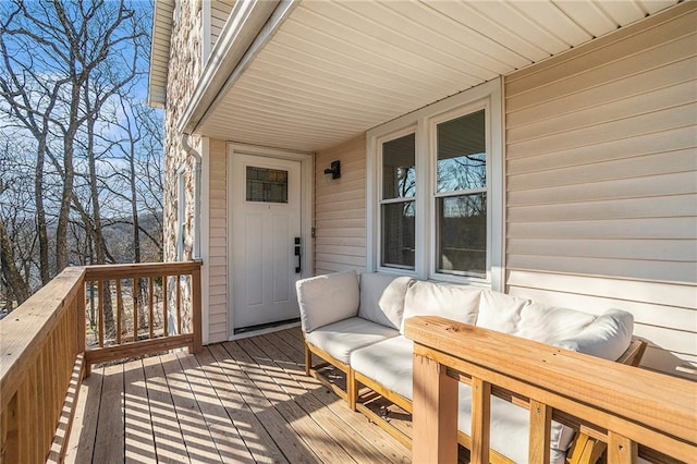 wooden deck with an outdoor hangout area