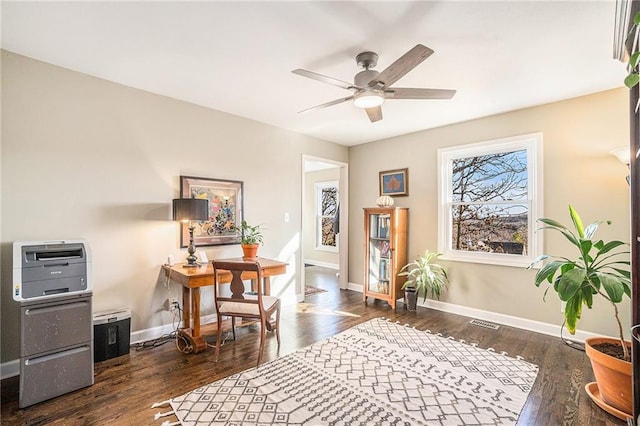 interior space with visible vents, dark wood-style floors, and baseboards